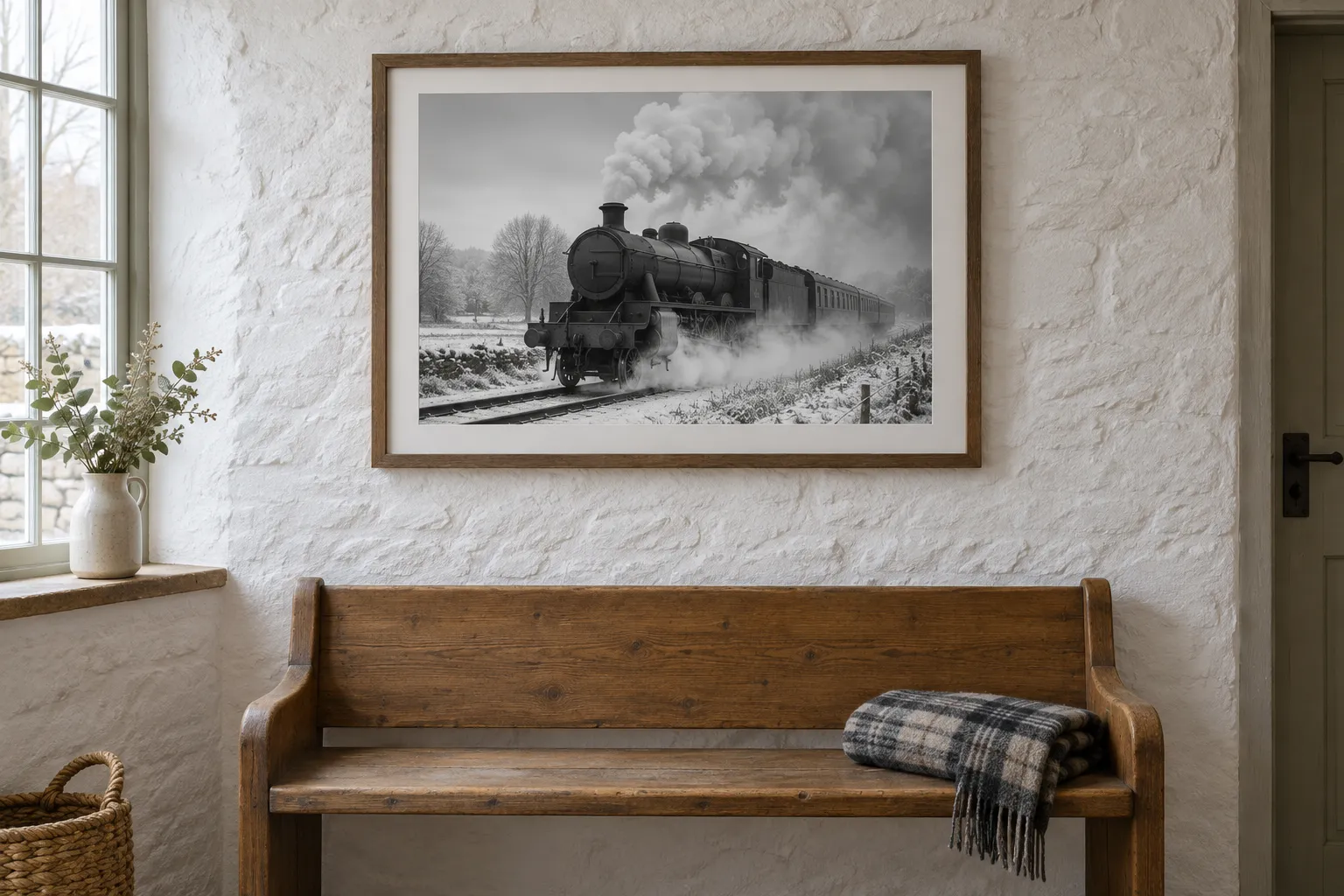 A framed black and white steam photograph above a cottage bench