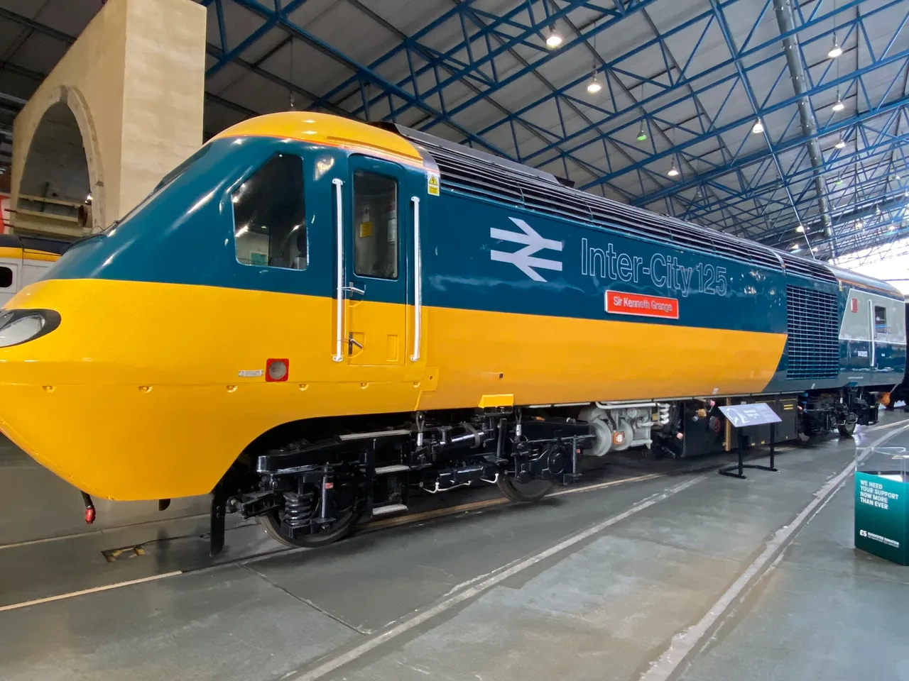 High Speed Train power car 43002 in its original yellow and blue InterCity 125 livery with the double arrow, on display at the National Railway Museum
