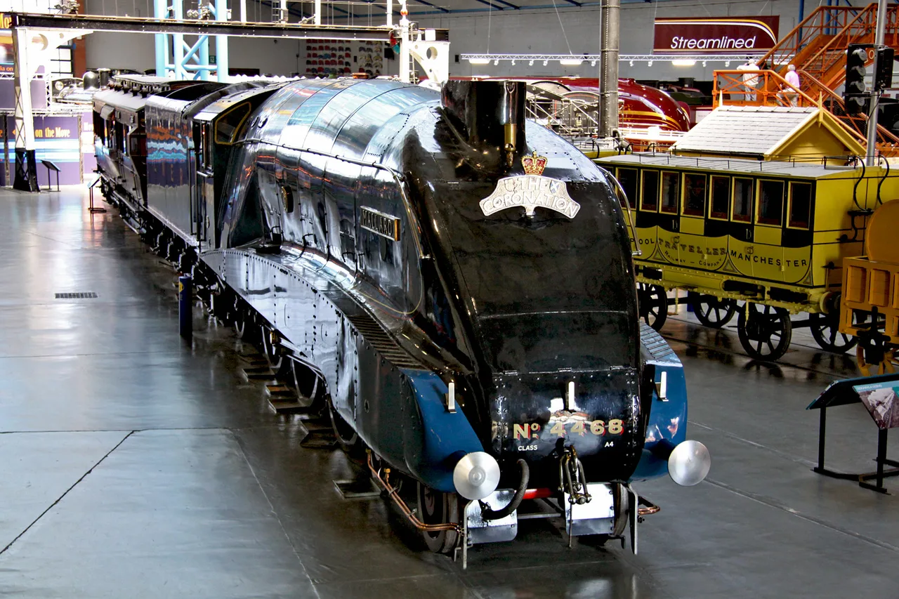 The blue LNER A4 locomotive Mallard, number 4468, on display in the great hall at the National Railway Museum